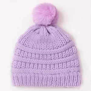 Knitted lavender baby beanie with fluffy pom-pom and warm rib-knit texture for winter