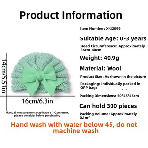 Détail du bonnet en tricot vert menthe pour bébé avec grand nœud et spécifications