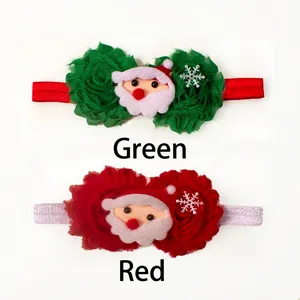 Detail of baby Christmas headbands with chiffon flowers and Santa Claus plush charms