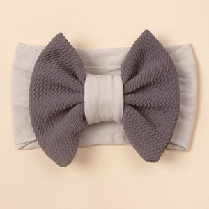 Elastisches Baby-Stirnband mit zweifarbiger grauer Schleife in Waffelstruktur aus Nylon