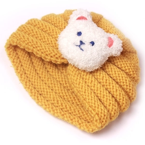 Infant winter knit beanie in yellow with a cute white teddy bear patch and soft texture