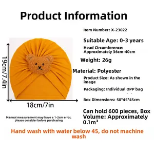 Detailed chart of yellow baby beanie with bear patch showing sizes and materials