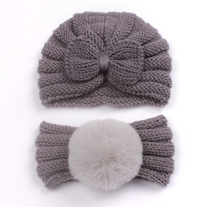 Detailed close-up of 2pcs baby knit set featuring dark grey bow hat and light grey pompom headband