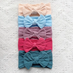 Lot de 5 bandeaux bébé en nylon souple avec nœuds papillon et texture tricotée torsadée