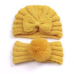 Yellow knit baby turban hat and headband set with bow and plush pom-pom detail