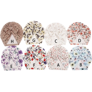Grid view of baby turban hats with eight assorted floral patterns and large bow details