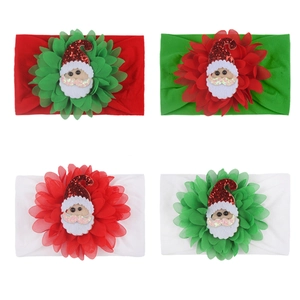 Detail of Christmas baby headbands with chiffon flowers and 3D Santa Claus patches