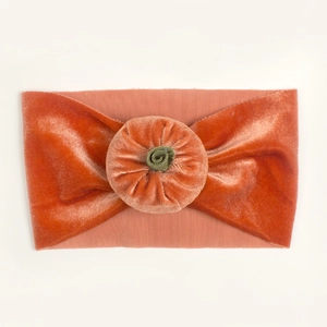 Orange velvet pumpkin baby headband for Halloween holiday with green stem detail