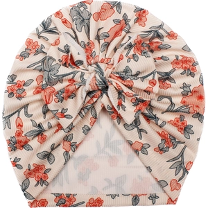 Floral baby turban hat with a large bow in soft stretch ribbed fabric on white background