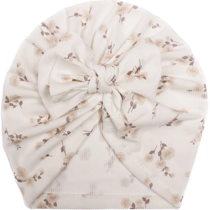 Detail of baby ribbed turban hat with vintage floral print and oversized bow accent
