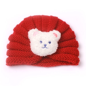 Cozy red baby knitted hat featuring a cute white plush bear decoration for autumn winter