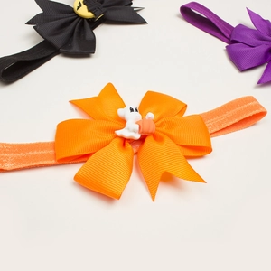 Three-piece Halloween baby bow headband set with festive pumpkin and ghost decorations