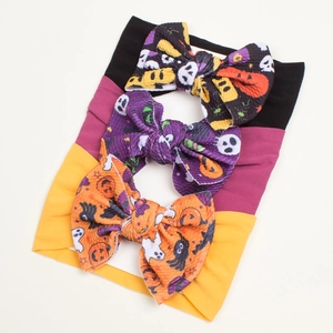 Detail of three-pack Halloween baby headbands featuring waffle fabric and festive prints