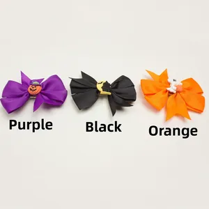 Detail of Halloween bow hair clips with pumpkin and bat resin decor in 3 colors