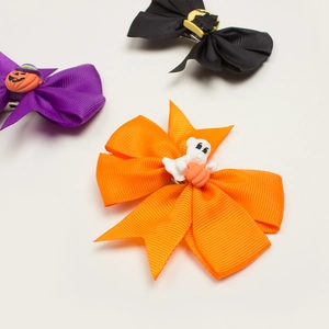 Three-piece Halloween hair clips set with pumpkin, ghost, and castle bows for babies