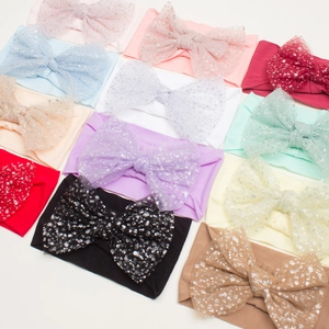 Set of baby nylon headbands with sparkling glitter mesh bows in various pastel colors