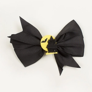 Close-up of black ribbed ribbon bow with bat and castle motif for Halloween hair clip