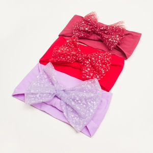 Three-piece baby headband set featuring large sequin mesh bows in red and purple