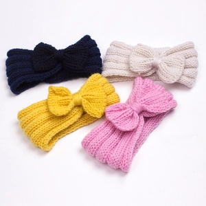 Set of 4 soft knitted baby bow headbands in navy, cream, mustard yellow and pink colors