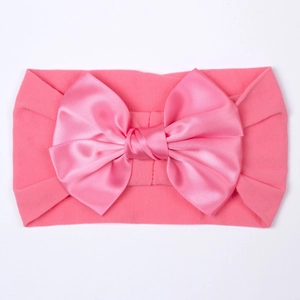 Roze zachte nylon baby hoofdband met grote satijnen strik voor meisjes rekbaar haarband