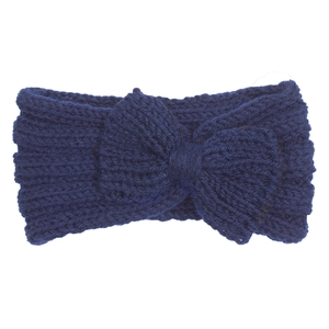 Detailed texture of navy blue knitted baby headband with decorative bow tie