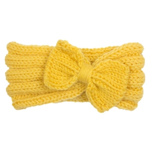 Detail of yellow knitted baby headband with a large bow showing soft ribbed texture