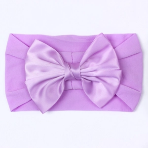 Zachte paarse nylon baby hoofdband met een grote stretch satijnen strik voor peuters