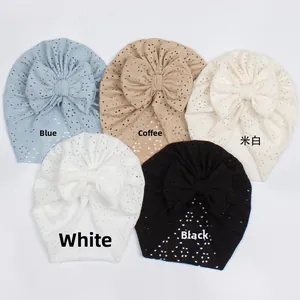 Detail showing baby turban hats in hollow eyelet fabric with various color options