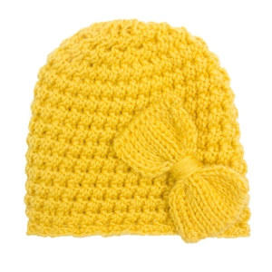 Close-up of bright yellow knitted baby hat featuring a large decorative side bow detail