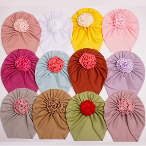 Ribbed baby turban hat with decorative fabric flower in 11 multiple color options