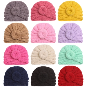 Winter newborn knit turban hats with donut knot design available in 12 vibrant solid colors