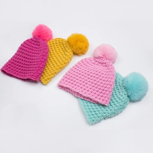 Winter thick knit baby beanies with large faux fur pom poms in four vibrant colors