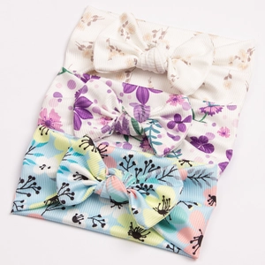 Three-piece set of ribbed elastic baby bow headbands with colorful floral patterns