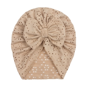 Breathable baby turban hat with large bow and hollow eyelet knit pattern in light brown
