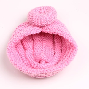 Detail view of pink baby knit turban hat with donut knot and ribbed texture fabric