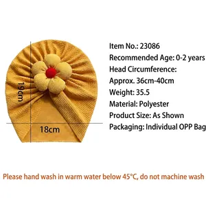 Yellow ribbed baby turban hat with 3D flower detail for infants aged 0 to 2 years