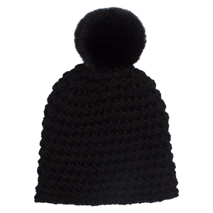 Close-up of black chunky knit baby beanie with a large fluffy faux fur pom-pom detail
