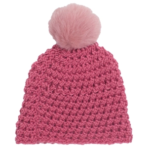 Detail of chunky knit texture and fluffy faux fur pom-pom on deep pink winter baby hat