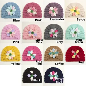Detail grid of knitted baby turban hats in 14 colors with fabric flower and button accents