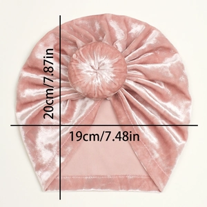 Detailed size view of a soft pink velvet baby turban hat with top knot measurement