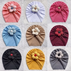 Detailed grid of ribbed newborn baby flower turbans in nine different soft pastel colors