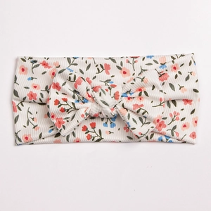 Floral print baby headband with soft ribbed cotton fabric and oversized bow tie knot