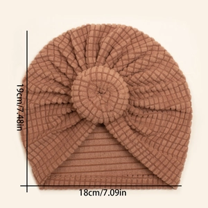 Size details of brown waffle baby turban hat with donut knot, dimensions 18cm by 19cm
