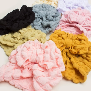 Elastic waffle fabric baby hats with large bow in various trendy solid colors
