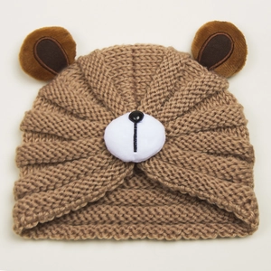Detailed close-up of brown knitted baby bear hat with 3D ears and cute animal design