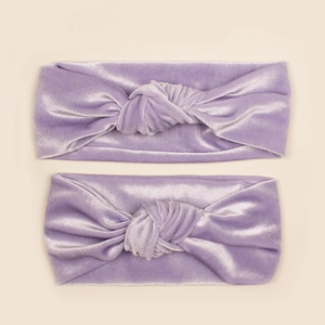 Detail of purple velvet parent-child headband set with soft knot design for women and babies