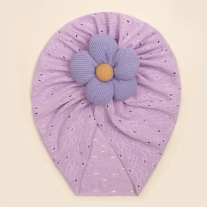 Detailed view of lavender baby turban featuring hollow knit texture and 3D floral accent