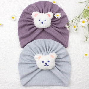 Two-pack of soft knitted baby bear turbans in purple and light grey for newborns
