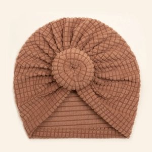 Brown soft waffle knit baby donut turban hat with a stylish front knot design
