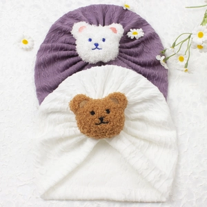 Cute baby jacquard beanies with plush bear decoration in purple and white colors